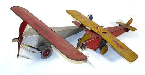 Appraisal: Tin lithographed airplanes Scarce grouping of three American decorative planes