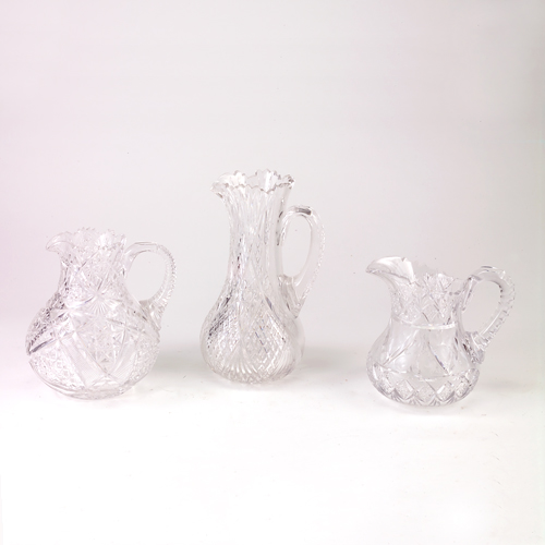 Appraisal: Three cut glass pitchers one with frosted fruits and flowers