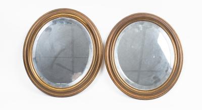 Appraisal: Two small brass oval mirrors with bevelled glass cm x