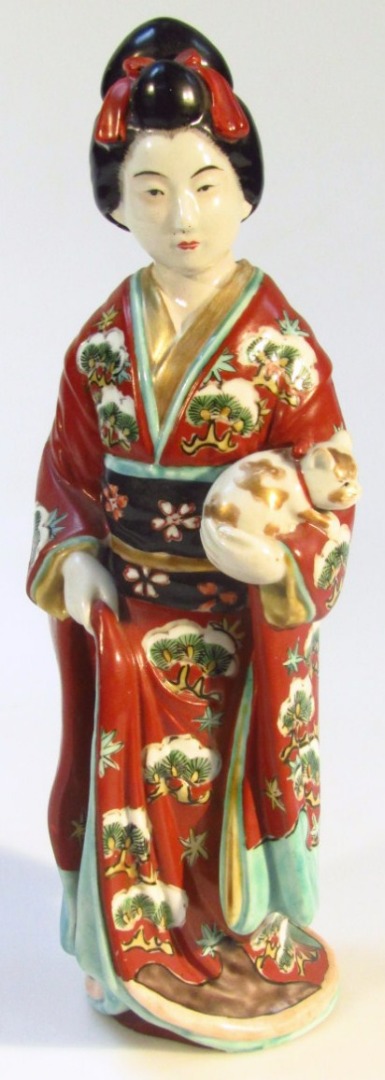 Appraisal: A thC semi porcelain figure of a geisha wearing flowing