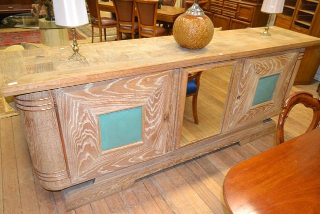 Appraisal: AN IMPRESSIVE FRENCH LIMED OAK SIDEBOARD WITH MIRRORED FITTINGS AN