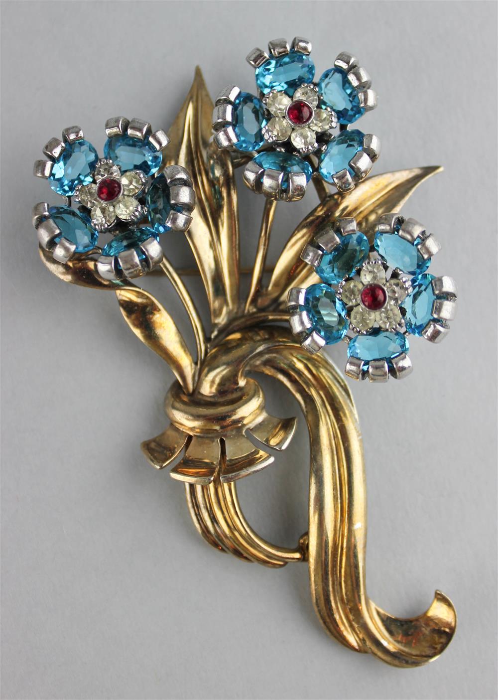 Appraisal: PENNINO STERLING FLOWER PIN WITH BLUE RED AND COLORLESS RHINESTONES