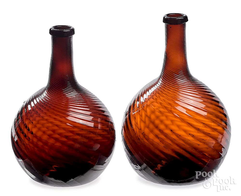 Appraisal: Two Zanesville Ohio blown amber glass bottles Two Zanesville Ohio