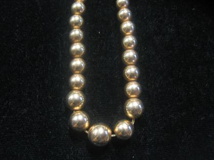 Appraisal: karat yellow gold beaded necklace th century Graduated gold beads