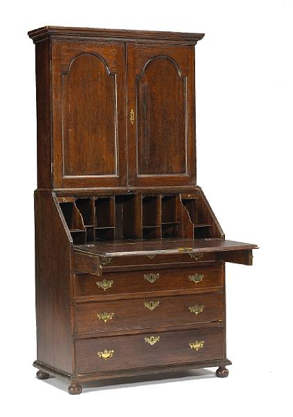 Appraisal: A George I oak secretary bookcase early th century The