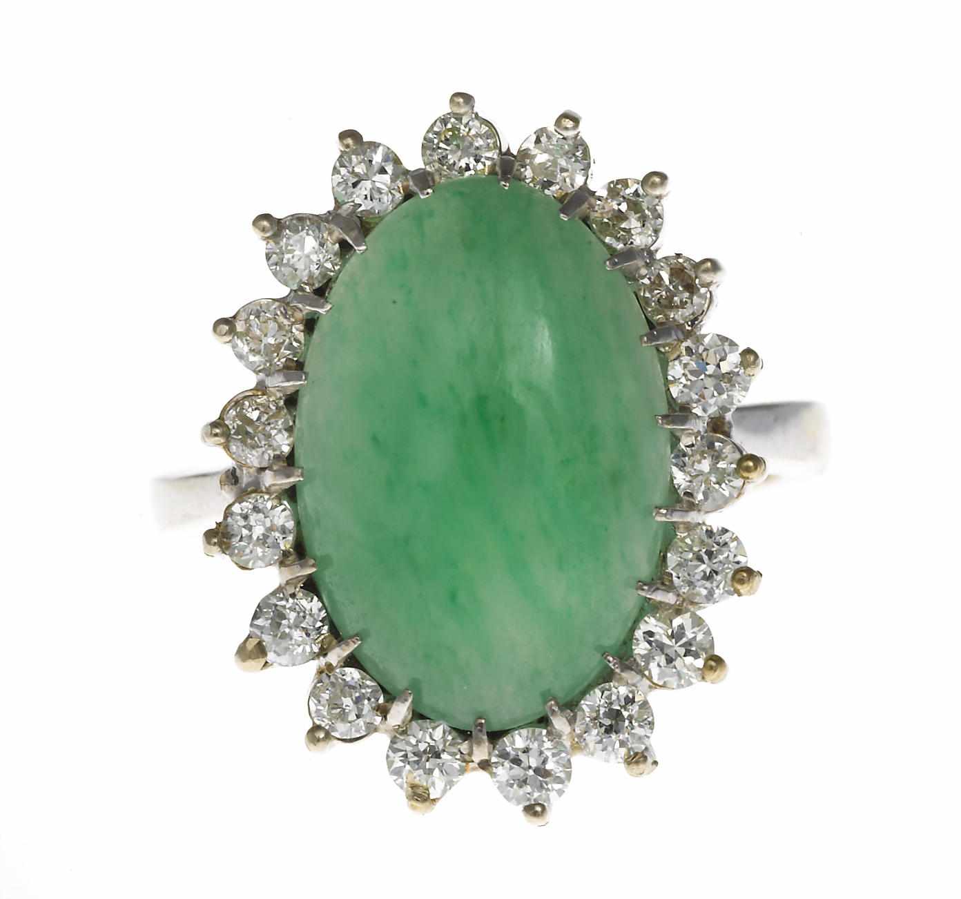 Appraisal: A jadeite jade and diamond ring oval jadeite-jade cabochon measuring