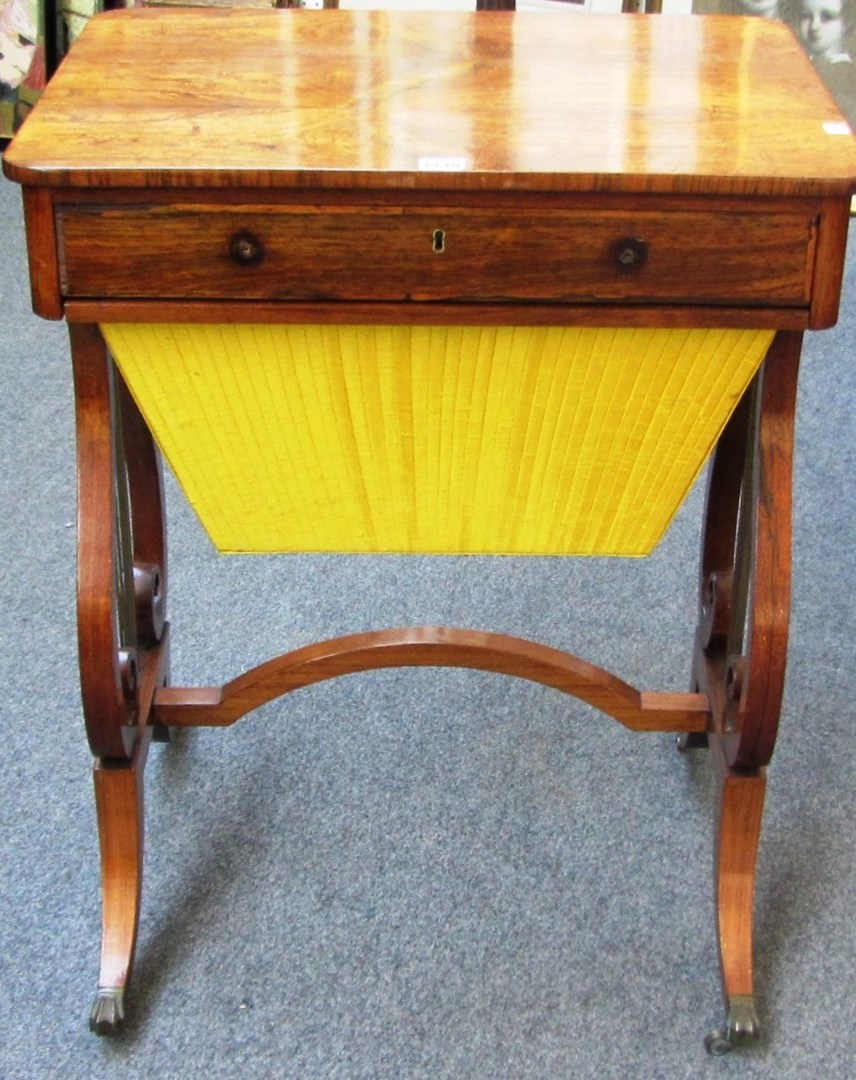 Appraisal: A Regency rosewood single drawer sewing table with pleated silk