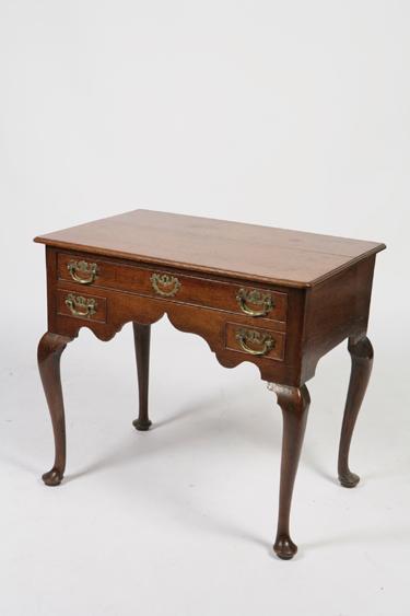 Appraisal: A GEORGE II OAK SIDE TABLE the rectangular top with