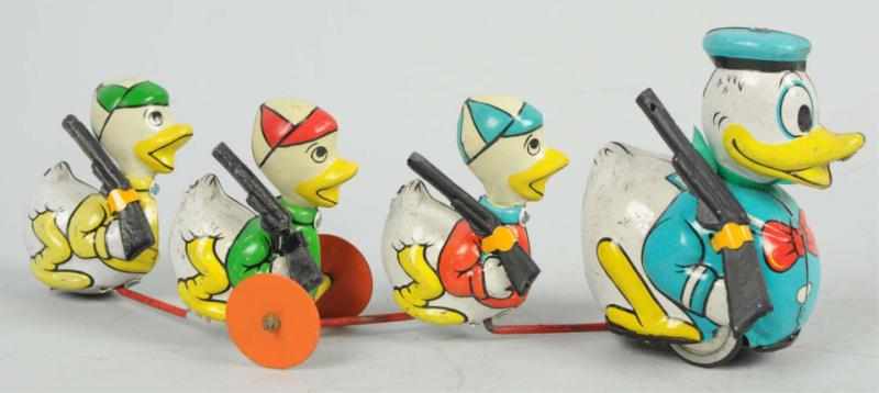 Appraisal: Tin Disney Linemar Donald Pulling Nephews Toy Japanese Wind-up mechanism