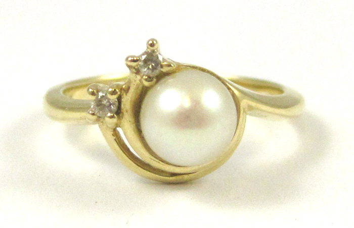 Appraisal: PEARL DIAMOND AND FOURTEEN KARAT GOLD RING set with two