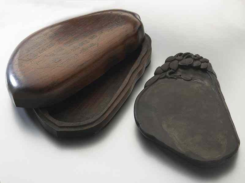 Appraisal: Chinese Qing carved Duan ink stone depictingleaves set in a