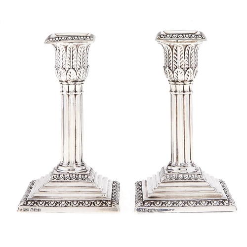 Appraisal: A pair of Edward VII silver dwarf cluster columnar candlesticks