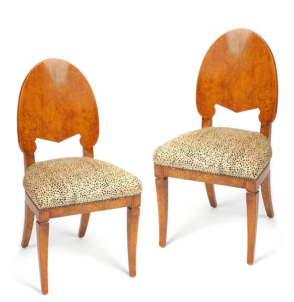 Appraisal: A pair of Biedermeier maple and fur upholstered side chairs