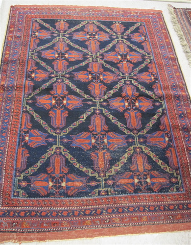 Appraisal: SEMI-ANTIQUE PERSIAN AREA RUG repeating cruciform medallion design in red