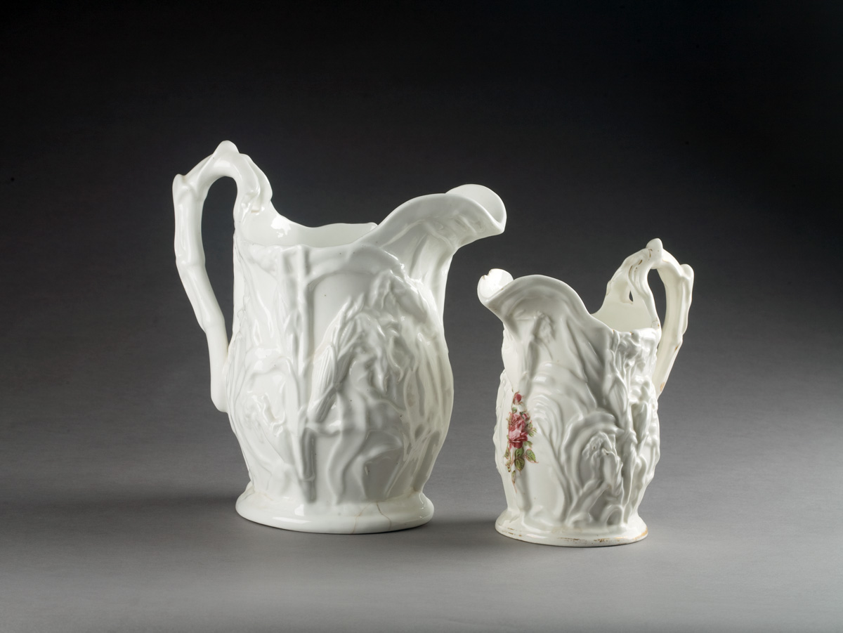 Appraisal: TWO AMERICAN PORCELAIN WHITE-GROUND PITCHERS MID-NINETEENTH CENTURY Each deeply-molded with