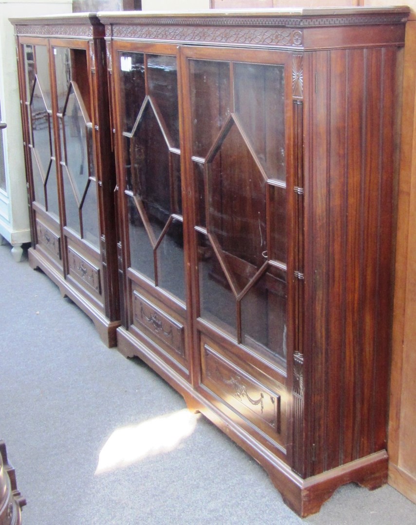 Appraisal: A pair of th century mahogany floor standing display cabinets