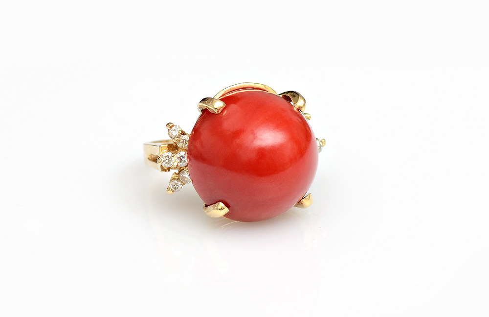 Appraisal: RED CORAL AND DIAMOND RING K yellow gold ring centering