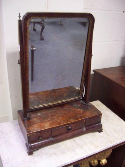 Appraisal: A Georgian mahogany box mirror the base fitted three drawers