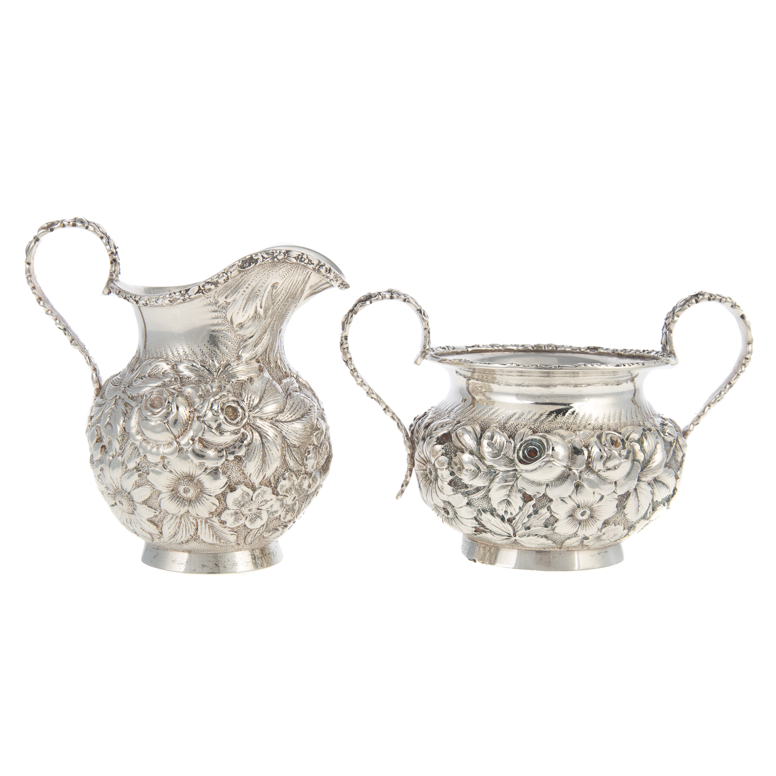 Appraisal: STIEFF STERLING REPOUSSE CREAMER SUGAR Each in an allover floral