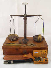 Appraisal: A set of jewellery balance scales with a range of