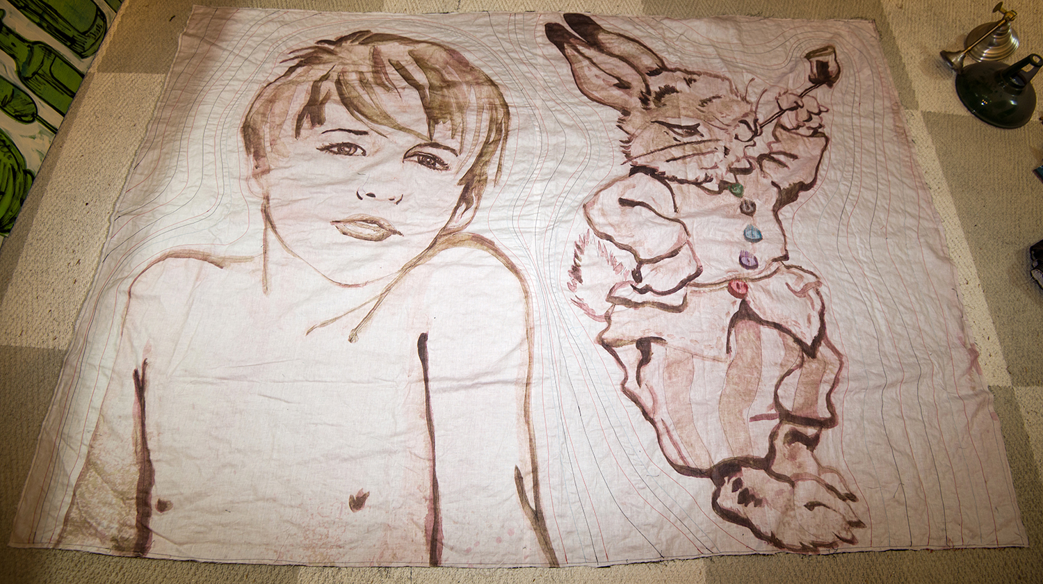 Appraisal: A LARGE DAVID BROMLEY QUILT DEPICTING A BOY WITH RABBIT