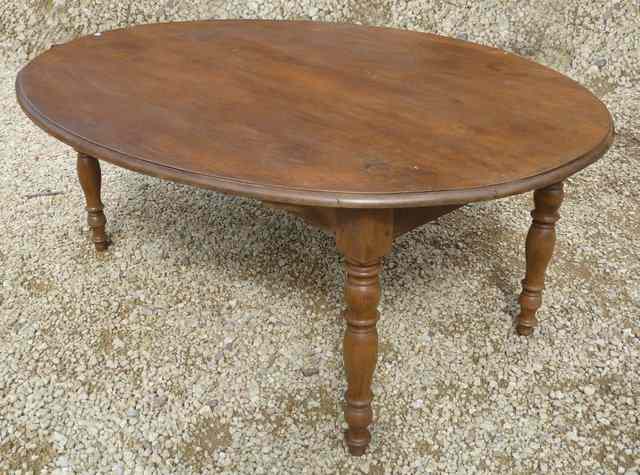 Appraisal: A FRENCH OVAL OAK DINING TABLE standing on turned tapering