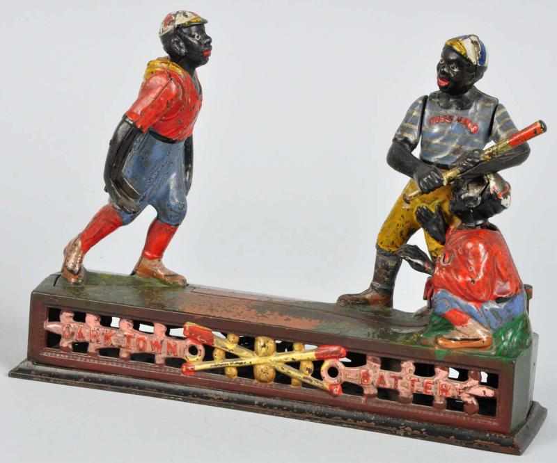 Appraisal: Cast Iron Darktown Battery Mechanical Bank Description Manufactured by J