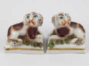 Appraisal: A pair of ceramic miniature King Charles spaniels gold anchor