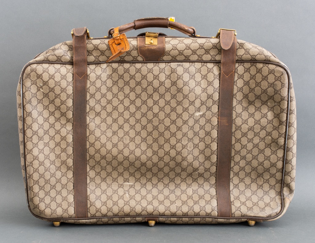 Appraisal: VINTAGE GUCCI MONOGRAM LUGGAGE BAG Vintage Gucci brown monogram luggage