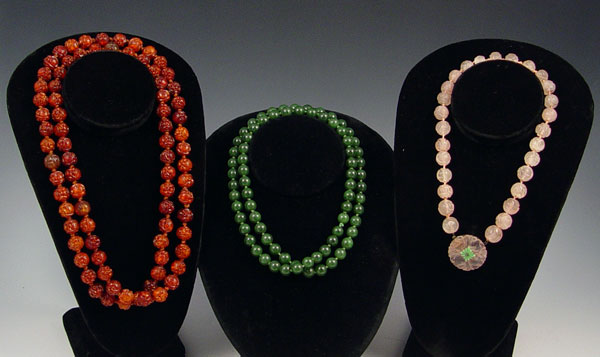 Appraisal: ESTATE CARVED AMBER CARVED QUARTZ AND JADE BEADS Group of