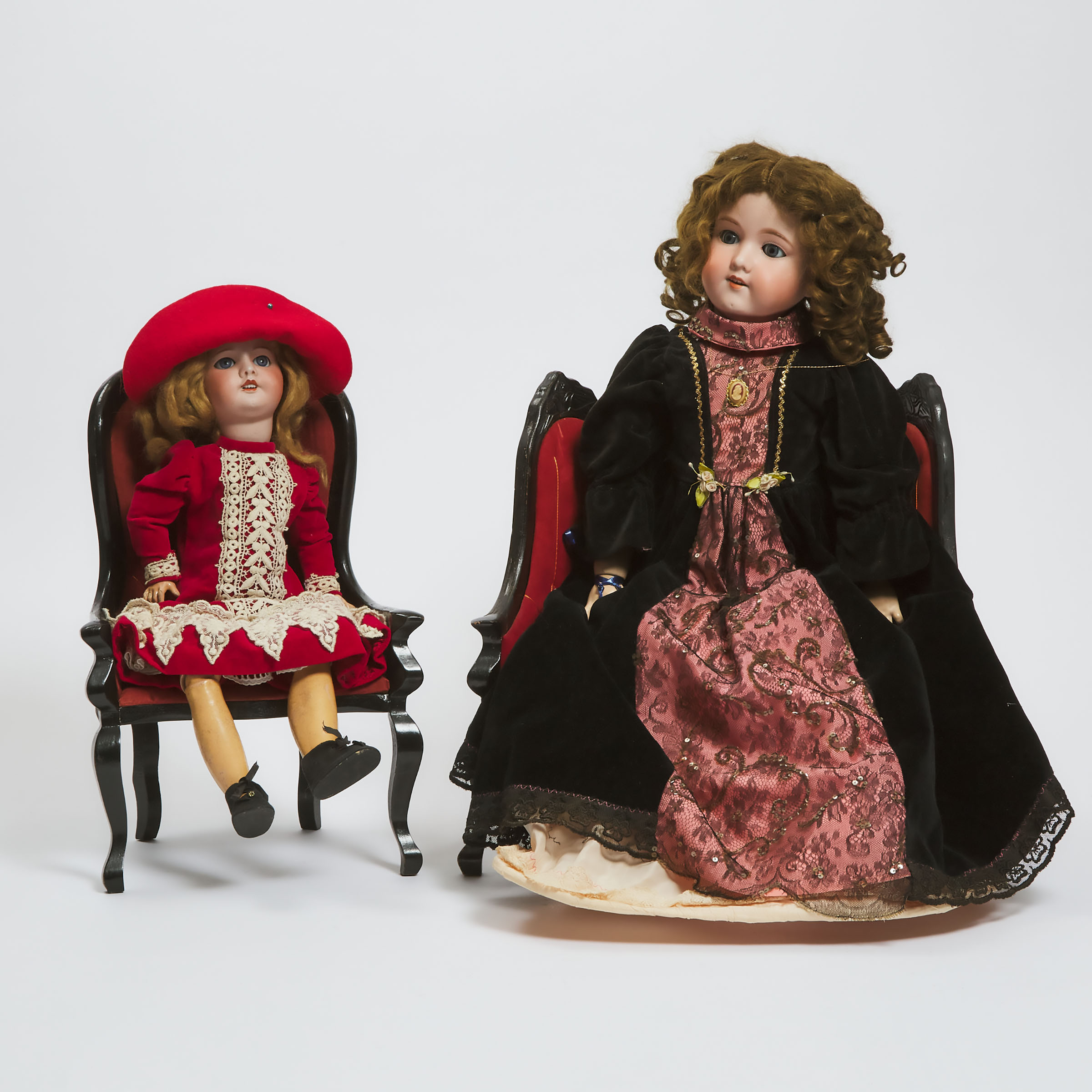 Appraisal: Two Continental Bisque Headed Dolls with Associated Furniture early th