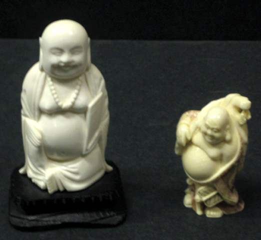 Appraisal: TWO CHINESE IVORY FIGURES Each standing one carved Laughing Buddha