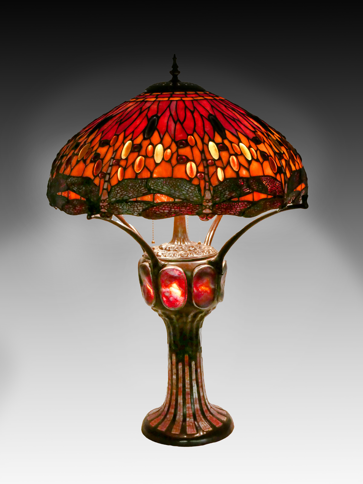 Appraisal: TIFFANY STYLE LEADED GLASS DRAGONFLY LAMP Large colorful stained glass