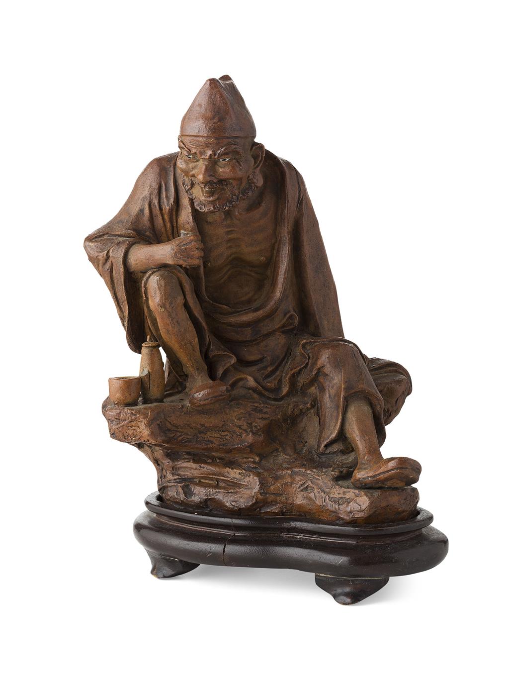 Appraisal: STONEWARE FIGURE OF JI GONG the Chinese Buddhist monk depicted