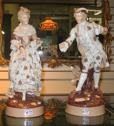 Appraisal: PAIR OF GERMAN GLAZED PORCELAIN FIGURES in the manner of