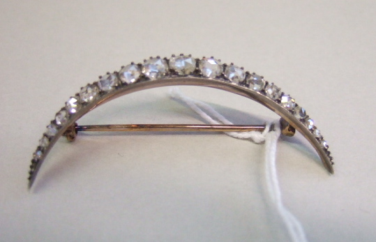 Appraisal: A Victorian rose diamond set brooch designed as a crescent