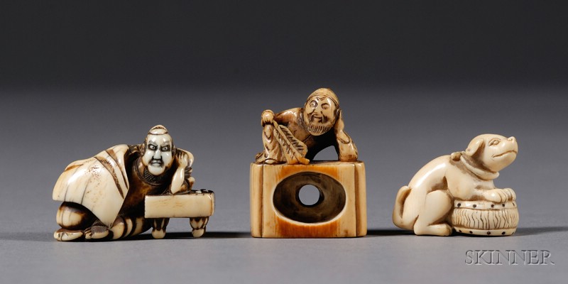 Appraisal: Three Ivory Netsuke th th century a shishi with a