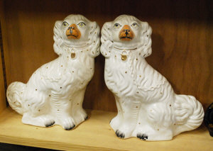 Appraisal: A pair of Staffordshire fireside spaniels to w a single