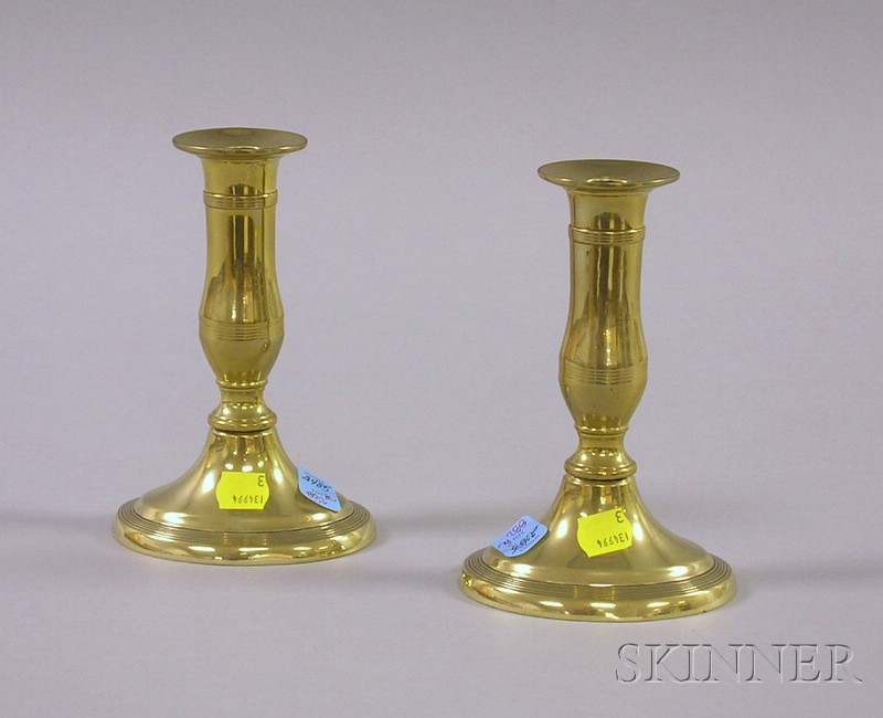 Appraisal: Pair of Brass Oval-base Push-up Candlesticks ht in