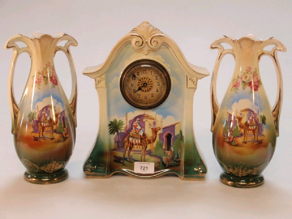 Appraisal: A Falcon ware Egyptian scene ceramic clock and matching vases