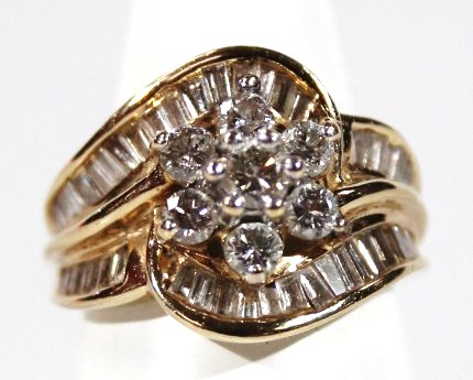 Appraisal: A diamond set cluster ring with floral centre and baguette