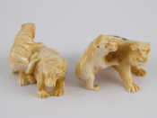 Appraisal: Two ivory netsuke circa one of a tiger and cub