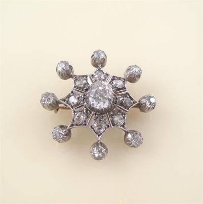 Appraisal: A Victorian diamond brooch centred with a cushion shaped diamond