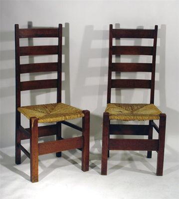 Appraisal: Four Heal's oak Letchworth ladderback chairs with rush seating unmarked