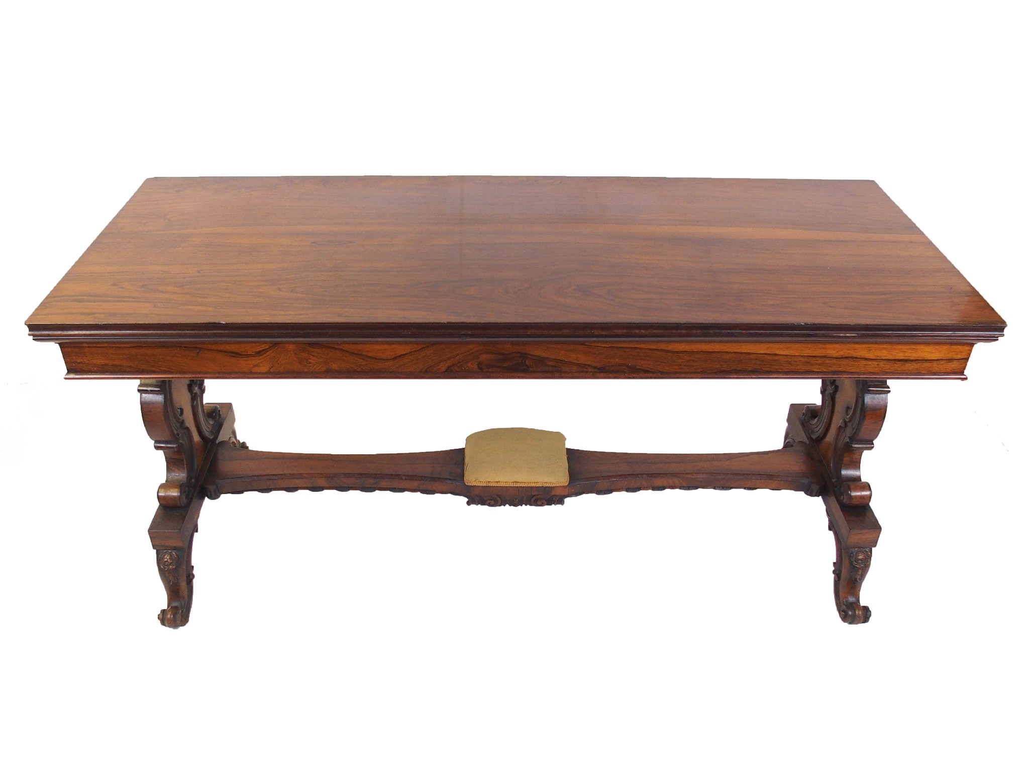 Appraisal: A Victorian rosewood library tablethe rectangular top on scroll carved