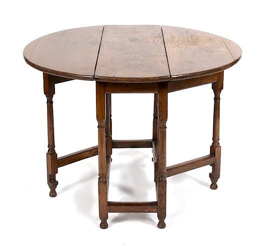 Appraisal: An English Jacobean Style Oak Gate Leg Table Height x