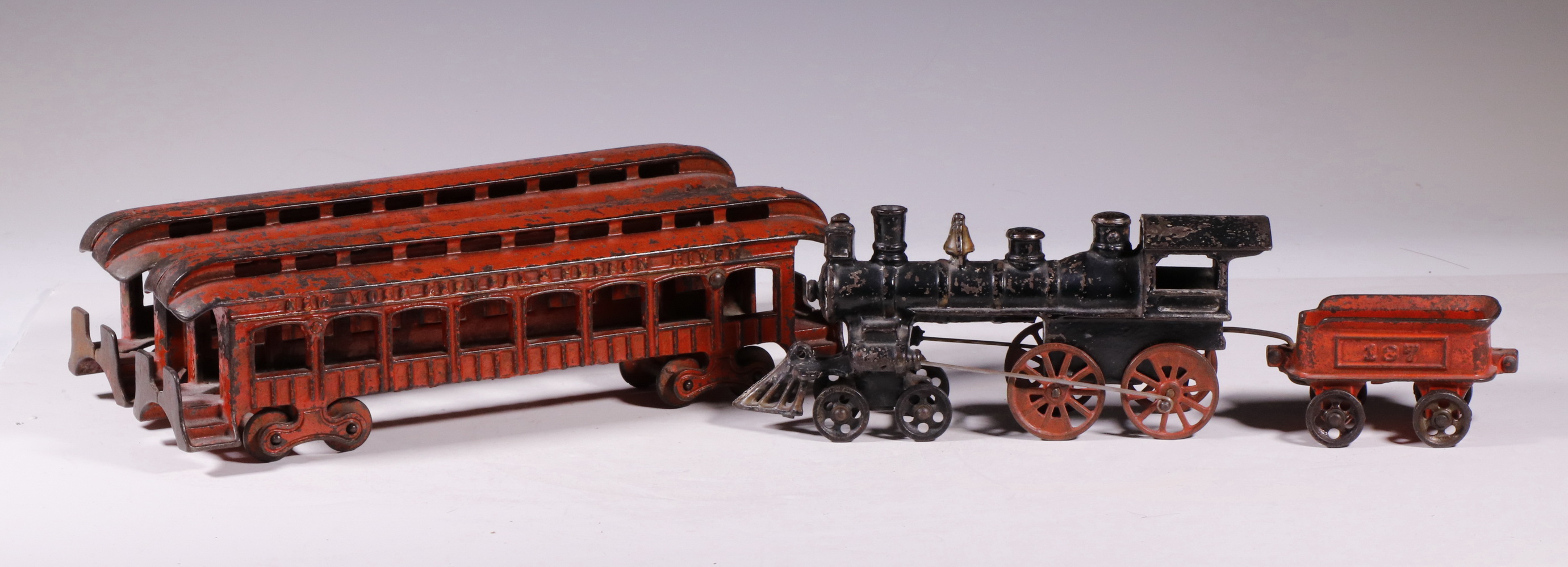 Appraisal: PCS CAST IRON TOY TRAIN Early cast iron locomotive with