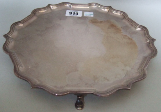 Appraisal: A silver salver with wavy rim and pad feet Sheffield