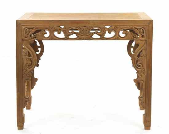 Appraisal: A Southeast Asian Pine Carved Console Table having a rectangular