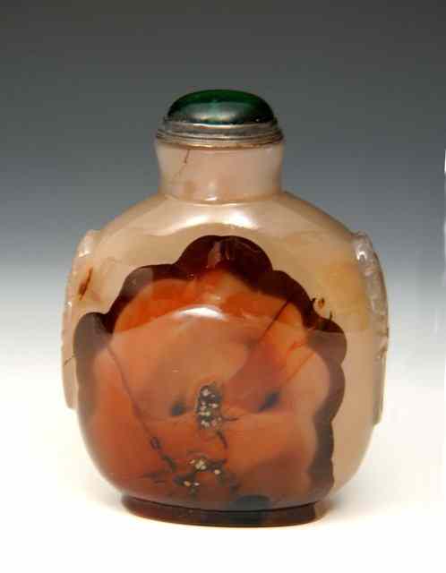 Appraisal: A CHINESE PALE BROWN CHALCEDONY SNUFF BOTTLE of rounded rectangular